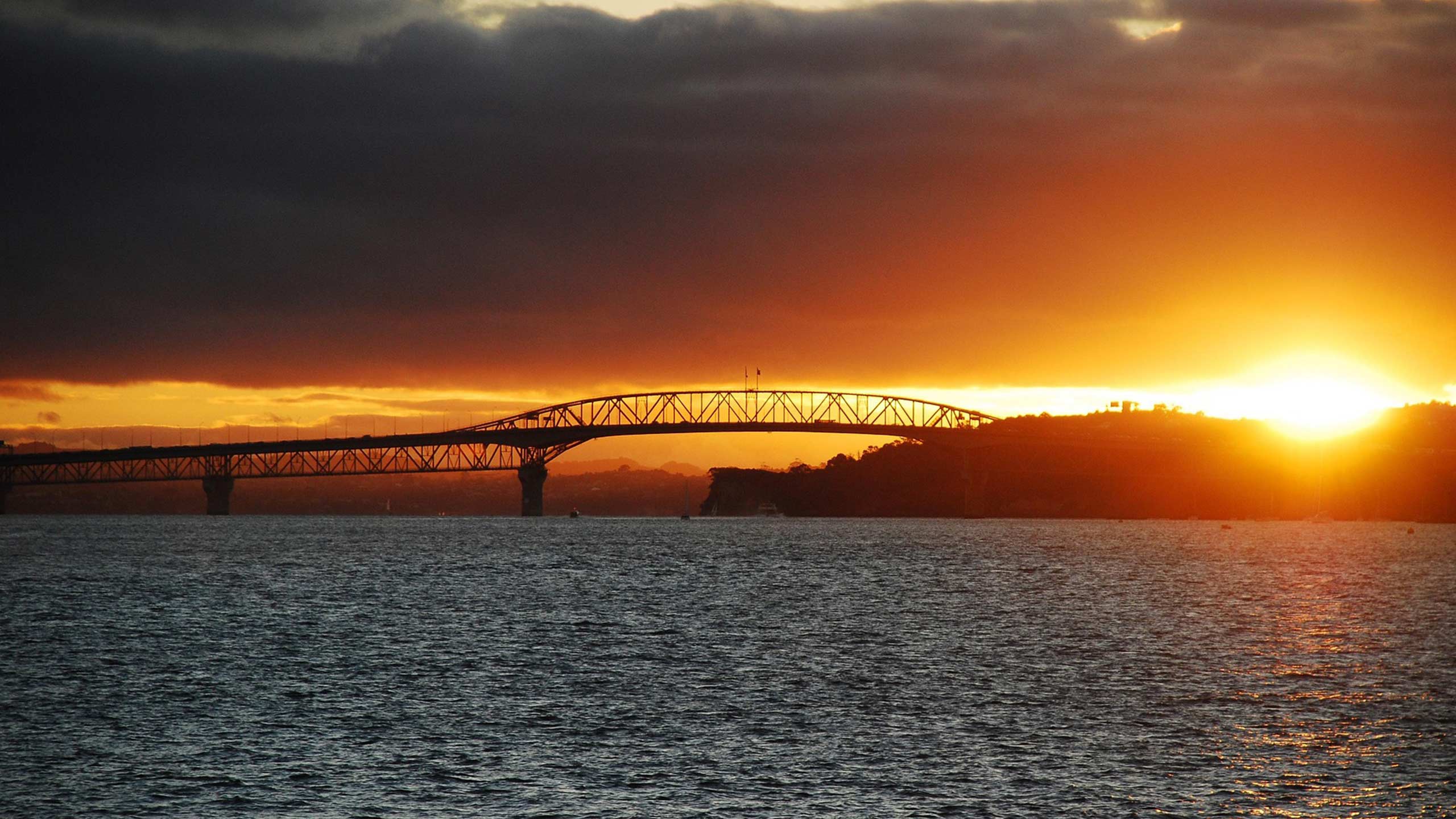 North-Shore-Electricians A sunny shot of the Harbour bridge with a sunset behind